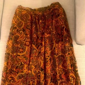 Vintage paisley print skirt. long and flowy and has some electric in the back.